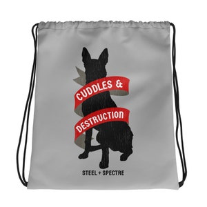 May include: Gray drawstring bag with a black silhouette of a dog and red text that reads "Cuddles & Destruction" with the words "Steel + Spectre" below the image.
