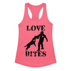 May include: A pink racerback tank top with the words "LOVE BITES" in black block letters. A black silhouette of a person and a dog are featured in the center, with heart details.