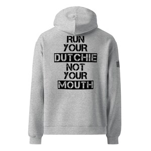 May include: Gray hooded sweatshirt with the text "RUN YOUR DUTCHIE NOT YOUR MOUTH" printed on the back.