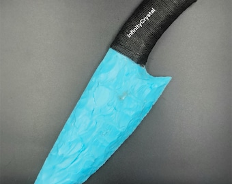 May include: A blue, hand-crafted knife with a black, rope-wrapped handle. The handle has the text "InfinityCrystal" written on it.