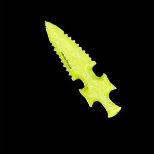 May include: A neon yellow arrowhead-shaped crystal with a serrated edge and a notched base. The text "InfinityCrystal" is printed on the crystal. The background is solid black.
