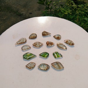 15 pcs of crystal andara polished pendant green and brown motifs
