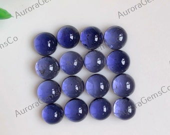 May include: Sixteen round, polished, deep blue gemstones arranged in a grid. The gems have a smooth, reflective surface, and are set against a white background. The gems are approximately 0.5 inches in diameter.