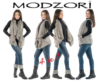 May include: Four different ways to wear a gray faux fur vest. The vest has a draped, asymmetrical design and is shown with a black turtleneck and blue jeans. The text "4 in 1" is printed on the image.
