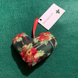 Handsewn stuffed cotton heart ornament with red ribbon hanger