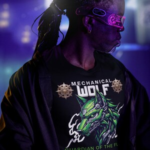 May include: Black t-shirt with a green and white mechanical wolf graphic. The text on the shirt reads "MECHANICAL WOLF" and "GUARDIAN OF THE FUTURE". The person in the image is wearing futuristic glasses.