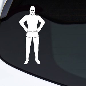 May include: White vinyl decal of a muscular man with a beard, sunglasses, and swim trunks. The figure is standing with hands on hips. The decal is applied to a car window.