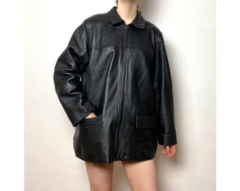 Vintage 90s leather zip up jacket with pockets.