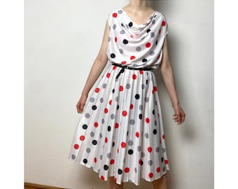 Vintage 60s dress with a cowl neckline and polka dot pattern