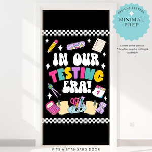 May include: Black door cover with the text "IN OUR TESTING ERA!" and school-themed illustrations. Includes a pencil, calculator, and scissors. The top and bottom feature a black and white checkered pattern. The text "PRE-CUT LETTERS MINIMAL PREP" is also visible.