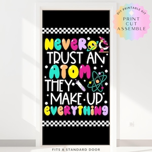 May include: A black door cover featuring the phrase "Never Trust an Atom They Make Up Everything" in vibrant, bubble-style lettering. The design incorporates science-related graphics and a checkered border. The words "DIY Printable Kit" are also visible.