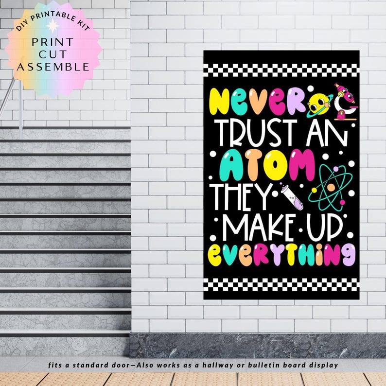May include: A black poster with the text "NEVER TRUST AN ATOM THEY MAKE UP EVERYTHING" in colourful bubble letters. The poster includes science-themed illustrations and is designed to fit a standard door or be used as a bulletin board display.