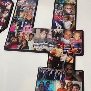 May include: A black framed collage of photos in the shape of the number four. The photos are of a family, including children, adults, and a group of girls playing basketball.