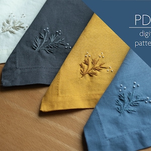 May include: Four embroidered napkins in different colors, including white, gray, yellow, and blue. Each napkin features a simple, stylized branch design with small white dots. The napkins are arranged in a row on a wooden surface. The text "PDF digital pattern" is visible in the upper right corner of the image.