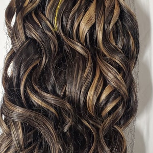 100 % human hair tangle-free weave; Natural Spanish wave; curly; weft; sew-in; for women.