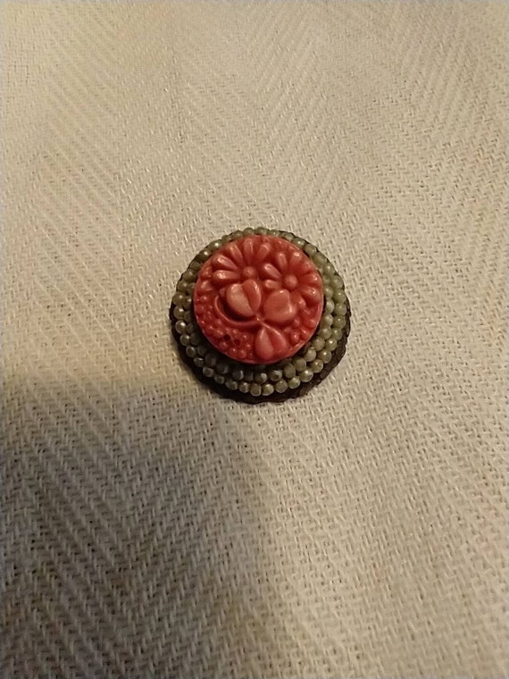 Coral colored flowers brooch