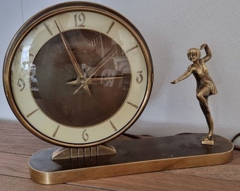 Art Deco table clock - Hesma - Made in Germany, bronze figurine of a ballerina. First half of the 20th century. Electric 220 volts.