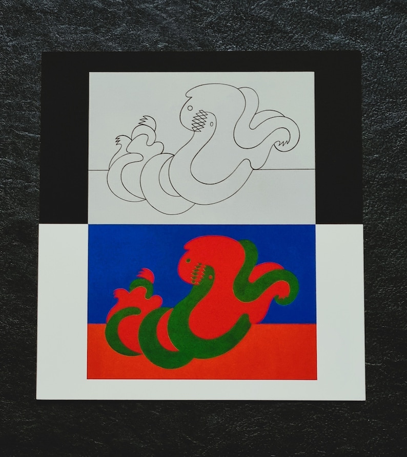 May include: A black and white line drawing of a green and red creature with a toothy grin, on a white background with a black border.