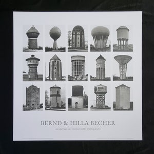 May include: A black and white photograph of a collection of water towers. The photograph is titled "Bernd & Hilla Becher" and "Collection of Contemporary Photographs".