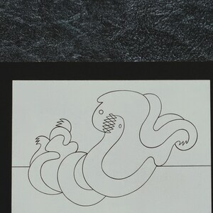 May include: Black and white line drawing of an abstract, organic shape resembling a creature with multiple limbs. The shape is drawn on a white background and framed with a black border.