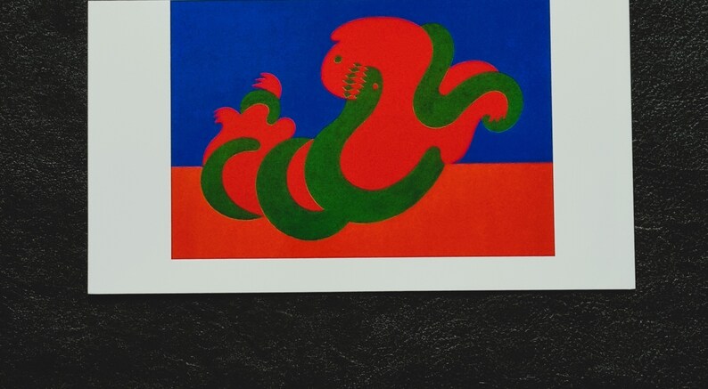 May include: Abstract art print featuring a red and green stylized creature on a blue and red background.
