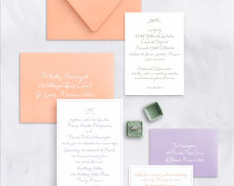 May include: A wedding invitation suite with peach and purple envelopes. The invitation card features a white border and a floral design. The text reads "Together with their families, Margo Amelia Montgomery and Patrick Michael Kensington invite you to celebrate their marriage Saturday, the nineteenth of March, two thousand twenty four, two in the afternoon, Karting Hills, 1156 Karting Hills Place, Pawley, Missouri."
