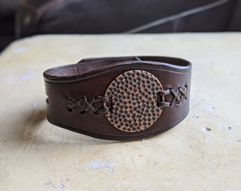 Full Grain Leather Cuff Bracelet with vintage metal medallion. Double snap closure on back of cuff. Made in USA. Sizing for adult. Unisex