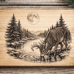 May include: A wooden plaque with a detailed monochrome illustration of a deer drinking from a river under a full moon. The artwork includes pine trees and a mountainous landscape, creating a rustic, natural theme.