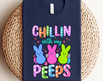 May include: Navy blue t-shirt with a colorful graphic of three Easter Peeps and the text "Chillin with my Peeps".