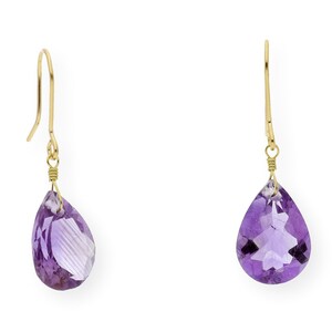 May include: A pair of gold dangle earrings with purple amethyst teardrop-shaped stones.