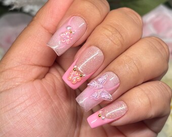 Barbie Garden | Nude glitter w/ pink French /airbrush, pearl gold beads + iridescent flower butterfly charms| Spring Summer | Apres Gel X