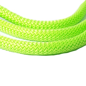 May include: Close-up of a bright green rope with a braided texture.