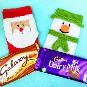 May include: Two knitted Christmas stocking-shaped gift bags, one with a Santa Claus design and the other with a snowman design, with a Galaxy Caramel Collection chocolate bar in front of the Santa stocking and a Cadbury Dairy Milk chocolate bar in front of the snowman stocking.