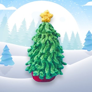 May include: A green crocheted Christmas tree with a yellow star on top, sitting on a red base. The tree is in a snowy winter scene.