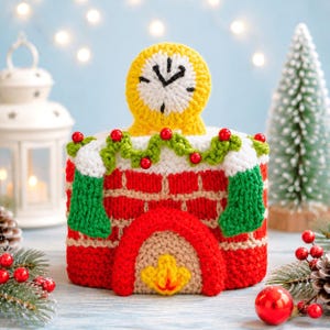 May include: A crocheted fireplace decoration featuring a red brick pattern, a beige hearth with a yellow flame, and a green garland with red beads. A yellow clock sits on top, and two green stockings hang from the mantle, all crafted in yarn.