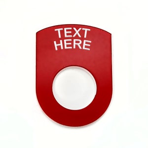 May include: Red plastic toggle switch with a round hole in the centre. The switch has white text that reads "TEXT HERE".