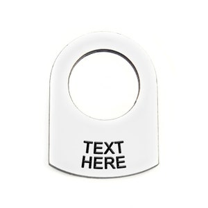 May include: White plastic toggle switch cover with a round hole and the text "TEXT HERE" printed in black.