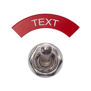 May include: A red toggle switch with the word "TEXT" printed on it. The switch is in the off position.