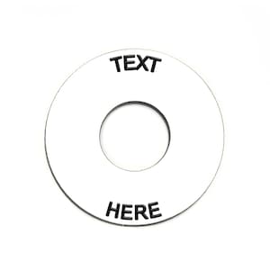May include: White round blank tag with a hole in the centre. The tag has black text that says "TEXT HERE".