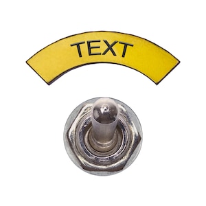 May include: A silver toggle switch with a yellow label that says "TEXT" above it.