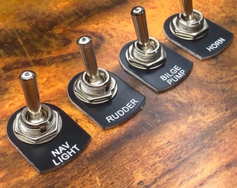 Zwarte marine grade tuimelschakelaarplaat voor boten, stof- en waterbestendig