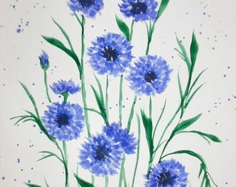 May include: Watercolor painting of blue cornflowers with green stems and leaves on a white background with blue splatter paint.