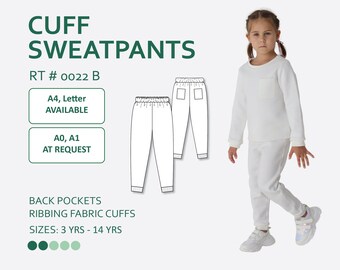May include: White sweatpants with ribbed cuffs and back pockets. The sweatpants are shown on a child model. The text "CUFF SWEATPANTS RT # 0022 B" is at the top of the image. The text "A4, Letter AVAILABLE" and "A0, A1 AT REQUEST" are in two separate boxes below the title. The text "BACK POCKETS RIBBING FABRIC CUFFS SIZES: 3 YRS - 14 YRS" is at the bottom of the image.