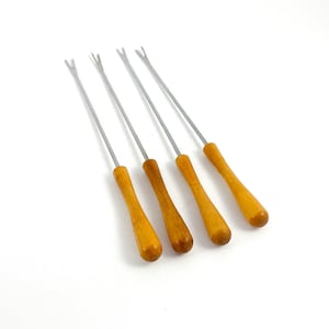 May include: Set of four fondue forks. Each fork has a stainless steel tine section and a wooden handle. The handles are a light brown color. The forks are angled slightly to the right against a white background.