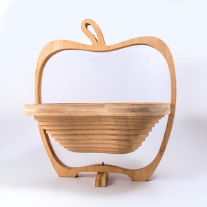 Wooden collapsible apple shaped fruit bowl.