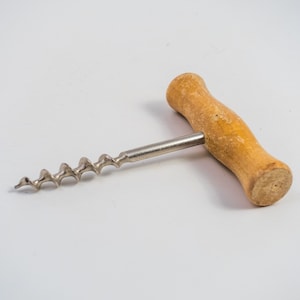 Vintage cork screw with wooden handle. Made in Italy