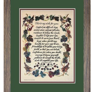 Puede incluir: Obra de arte enmarcada con un passe-partout verde y un marco de madera. La obra presenta un poema escrito a mano rodeado de ilustraciones de p&aacute;jaros y vides. El poema comienza con "This is my wish for you:" y contin&uacute;a con versos inspiradores.