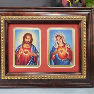 Sacred Heart of Jesus and Immaculate Heart of Mary framed picture.