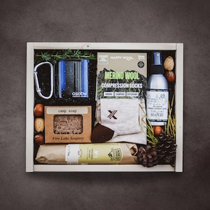 Personalized Camping Gift Box: Camp Mug, Wool Hiking Socks, Bug Spray, Camp Soap, Snacks & Custom Engraved Hardwood Box. Wool Blanket Option