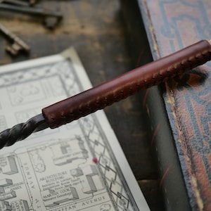 Hand Forged Metal Wand with Stitched Leather Handle